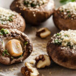 Garlic stuffed mushrooms piled with a buttery garlic, walnut, and herb mix, topped with Parmesan and baked until golden.