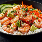 A photo showing a prawn rice bowl with sesame seeds scattered on the top.